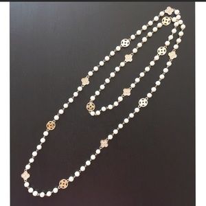 Long faux pearl necklace.